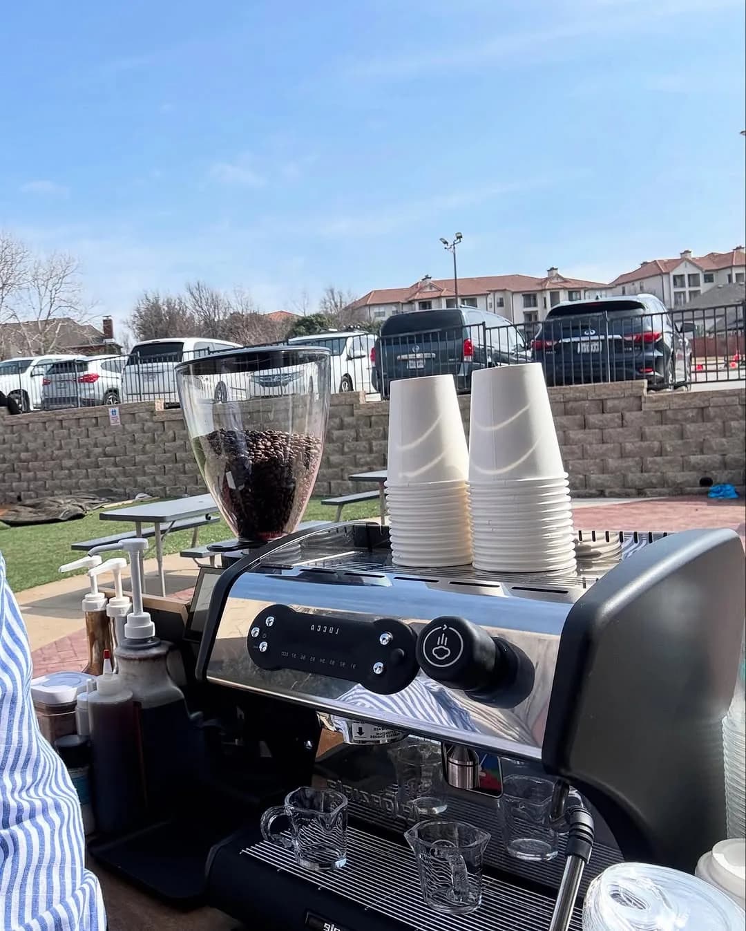 Bidaya coffee cart set up outdoors at a Dallas-Fort Worth event, espresso machine and cups ready