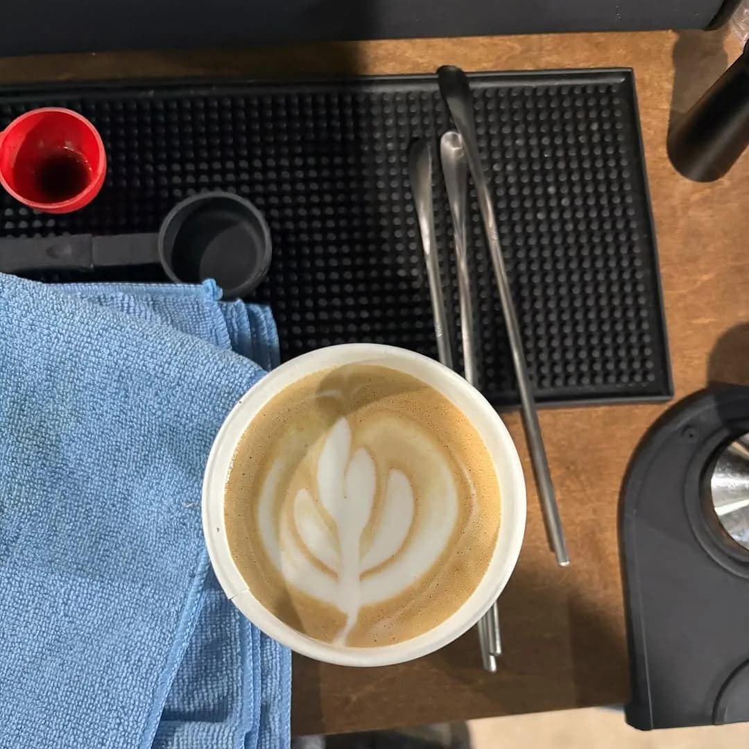 A handcrafted latte with latte art poured on the Bidaya coffee cart