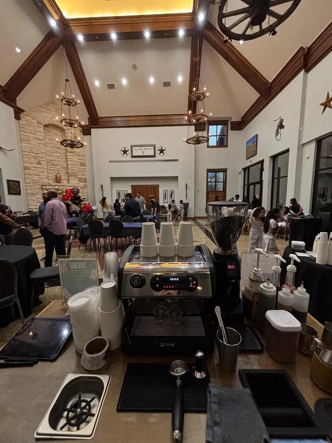 The espresso machine and grinder on the Bidaya cart inside a Dallas-Fort Worth event venue