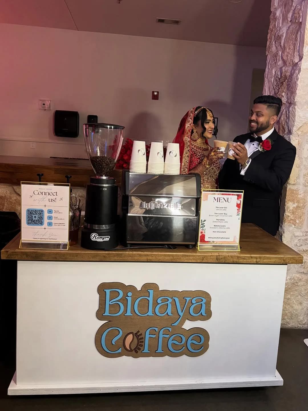 Bride and groom holding drinks at the Bidaya wedding coffee cart